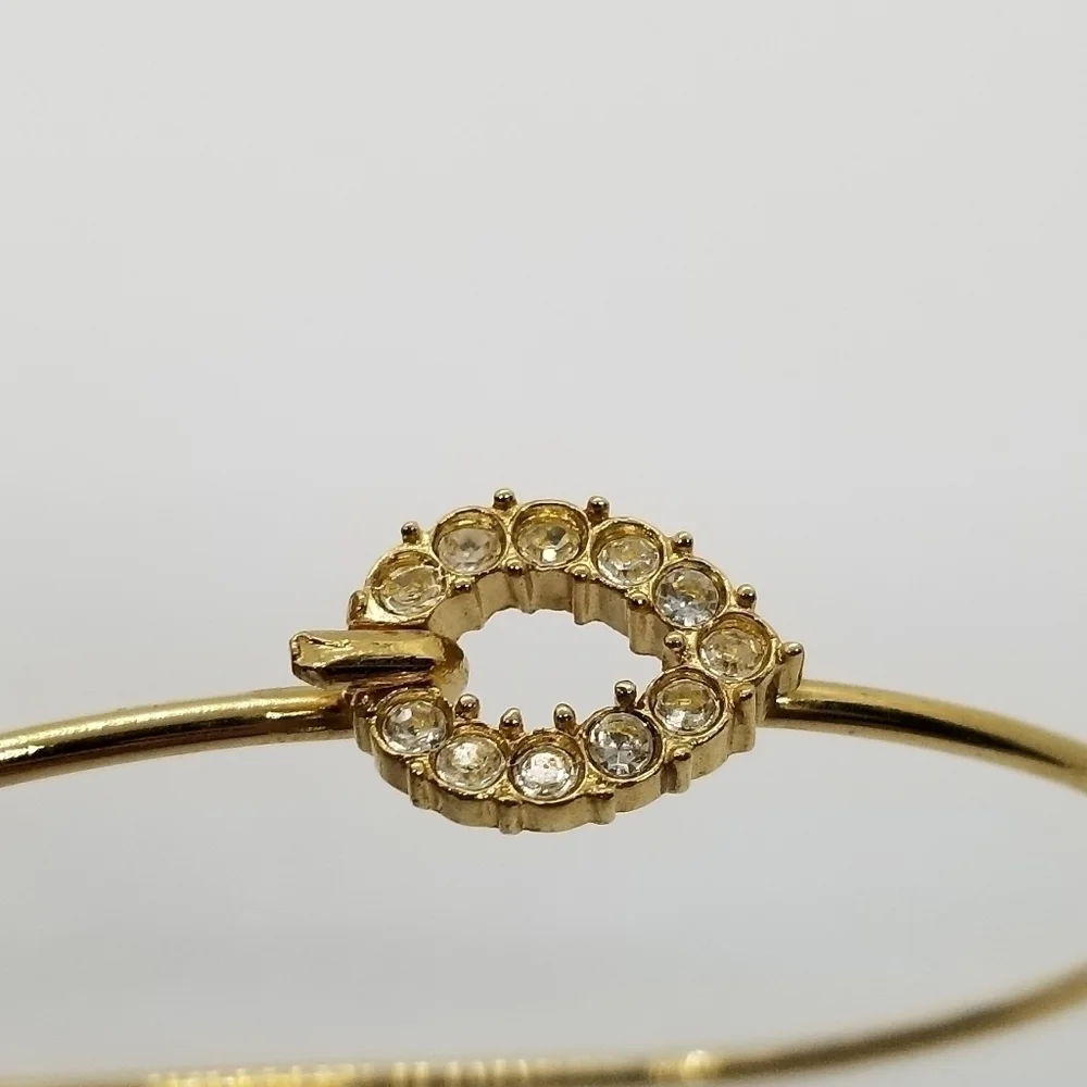 gold tone bracelet with pave rhinestone teardrop clasp